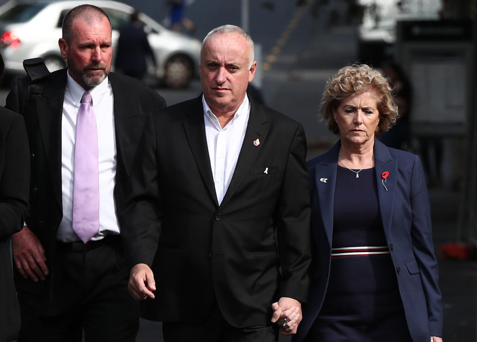 AUCKLAND, NEW ZEALAND - NOVEMBER 06:  Grace Millane's parents David (C) and Gillian (R) arrive with Detective Inspector Scott Beard (L)  at Auckland High Court on November 06, 2019 in Auckland, New Zealand. A 27 year old man is charged with the murder of British backpacker Grace Millane, whose body was found  in bush in West Auckland's Waitakere Ranges on 9 December 2018. There is currently a suppression order in place, prohibiting the publication of the accused's name. (Photo by Fiona Goodall/Getty Images)