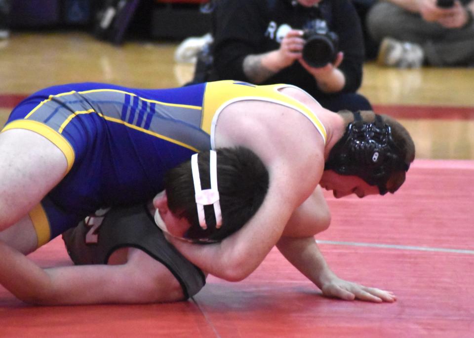 Bronson's Jacob Dixon slowly works Union City's William Thompson to a pin Saturday.