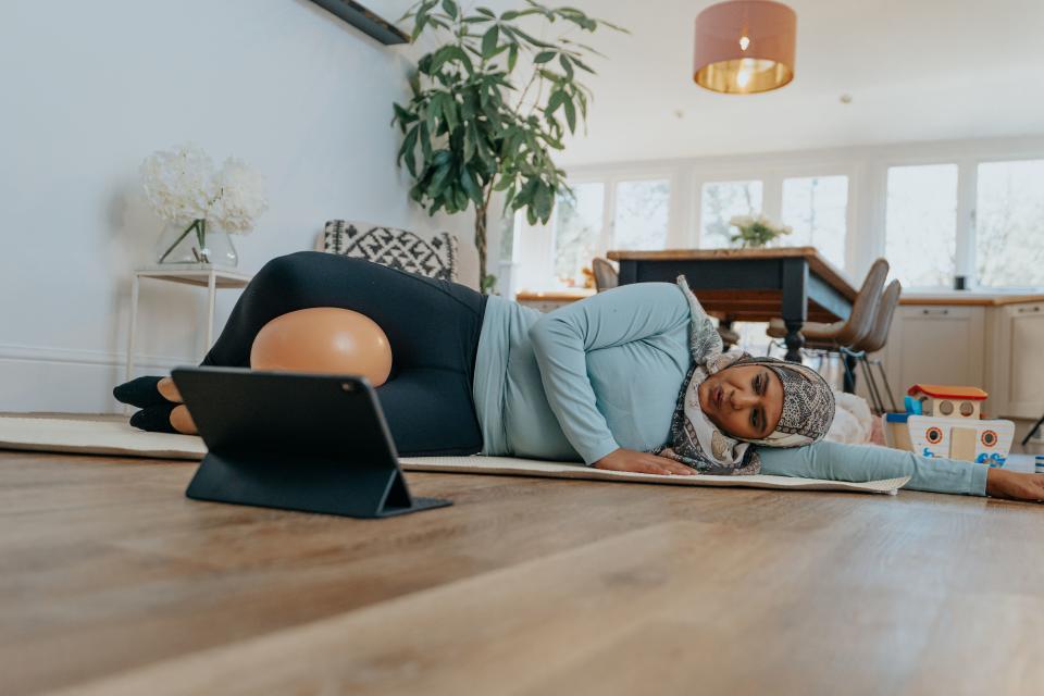 Woman doing The Bump Plan Postnatal exercise video