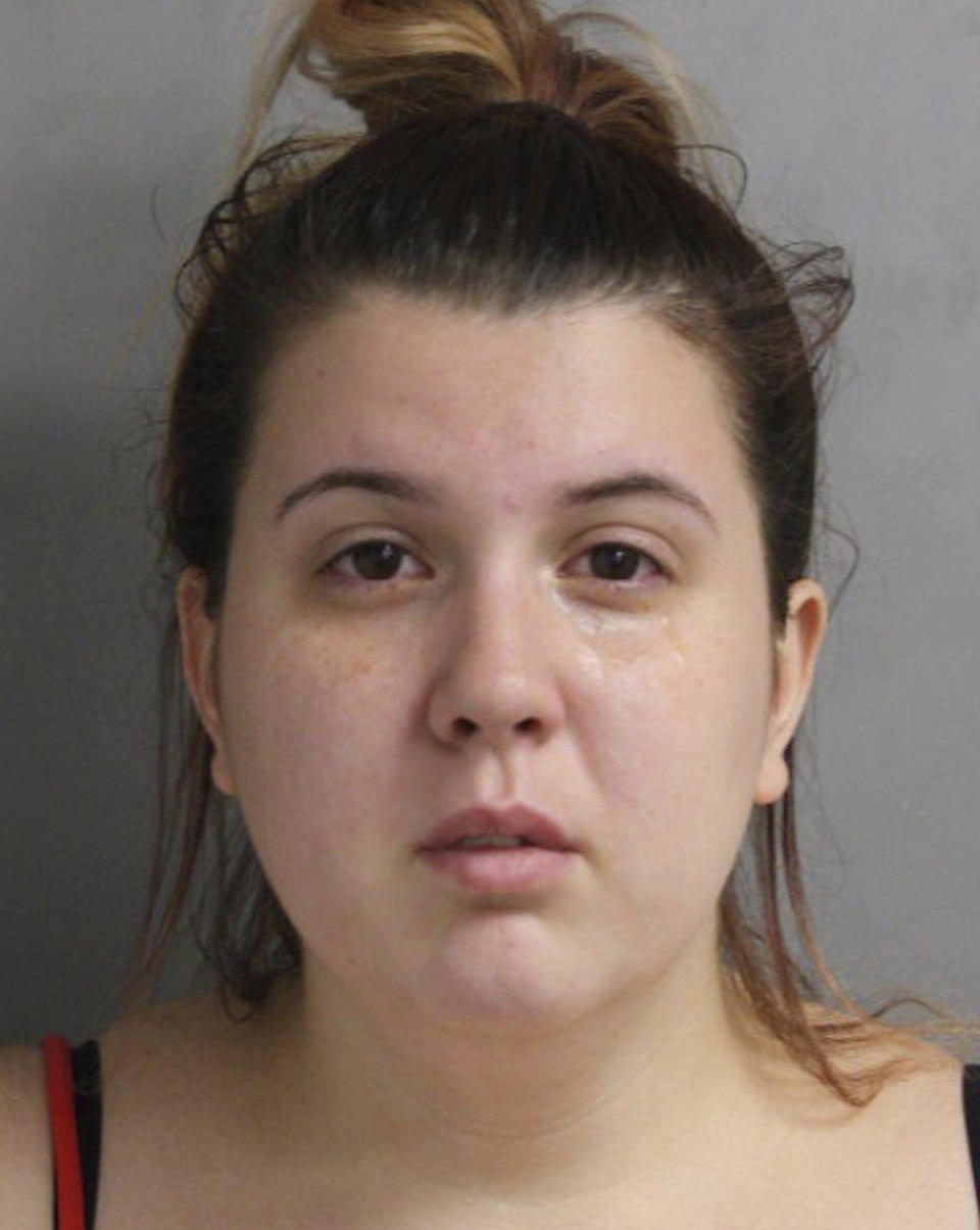 This photo provided by the Houston Police Department shows Katharine Wyndham White. White, the mother of a Houston infant, has been charged in her death after an autopsy found the child suffered a cracked skull and more than 90 fractures just days after being brought home from the hospital. Harris County prosecutors said Monday, June 24, 2019, that Jazmine Robin, who was born prematurely, was 10 weeks old when she died July 15, 2018, 12 days after leaving the hospital. Her father, 24-year-old Jason Paul Robin, and her mother, White, are facing charges. (Houston Police Department via AP)