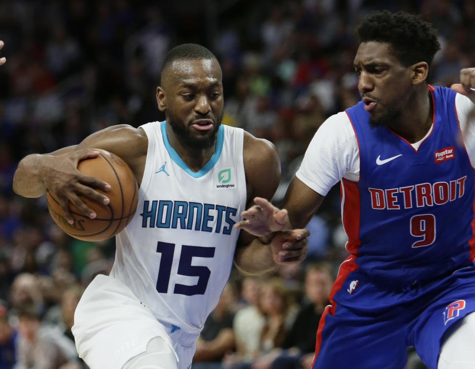 File-This April 7, 2019, file photo shows Charlotte Hornets guard Kemba Walker (15) driving against Detroit Pistons guard Langston Galloway (9) during the second half of an NBA basketball game in Detroit. A person with knowledge of the situation says Kemba Walker has told the Charlotte Hornets of his intention to sign with the Boston Celtics once the NBA's offseason moratorium ends July 6. Walker is planning to meet with the Celtics on Sunday, June 30, 2019, to discuss and likely finalize a four-year, $141 million deal, according to the person who spoke to The Associated Press on condition of anonymity because neither Walker nor the Hornets publicly revealed any details. (AP Photo/Duane Burleson, File)