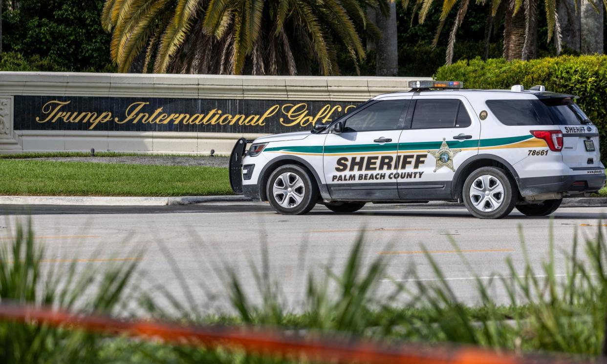 <span>Police crime scene vehicles are seen at Trump International golf club following the apparent assassination attempt against Donald Trump.</span><span>Photograph: Cristóbal Herrera/EPA</span>