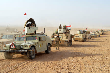 Iraqi forces vehicles are seen after they captured Rawa town, the last remaining town under Islamic State control, Iraq November 17, 2017. REUTERS/Stringer