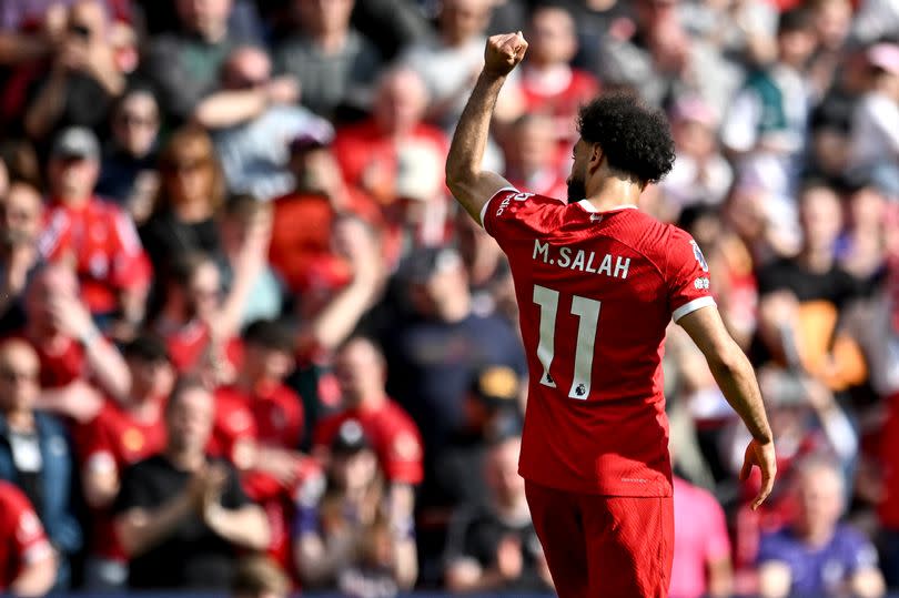 Mohamed Salah of Liverpool celebrates after scoring the opening goal during the Premier League match between Liverpool FC and Tottenham Hotspur at Anfield on May 05, 2024 in Liverpool, England.