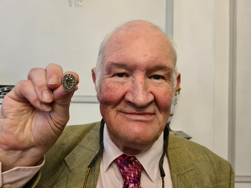 Andrew Phillips with the 14th century ring. (SWNS)
