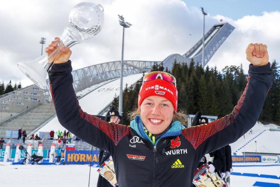 Laura Dahlmeier from Germany holds the trophy for overall victory in the Pursuit Cup, after IBU Biathlon World Cup Biathlon, Women 10 km pursuit competition in Oslo, Norway, Saturday March 18, 2017. (Heiko Junge, NTB Scanpix via AP)