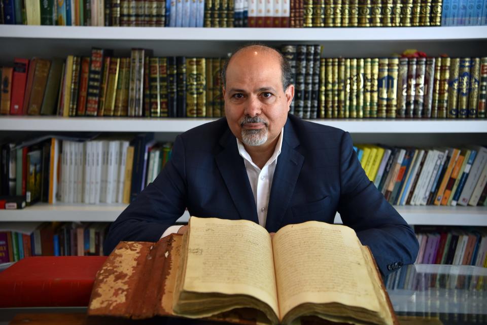 New Jersey attorney Abed Awad is a national expert on Sharia (Islamic law). Awad poses for a portrait in his home library, a collection of Islamic law books, current and antiquities dating back hundreds of years.