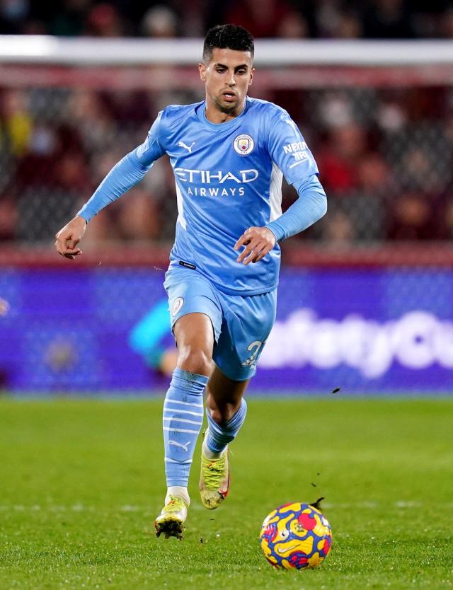 Manchester City's Joao Cancelo heads the ball during the Champions