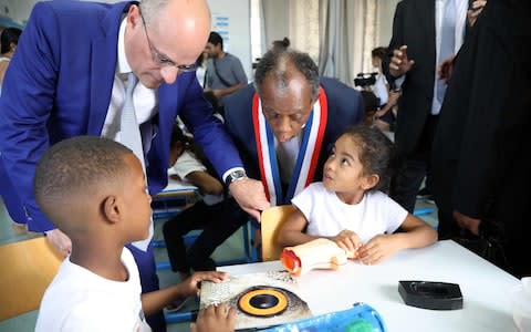 French Education Minister Jean-Michel Blanquer (L) visits the Henry Dunant public school on August 28, 2018 in Saint-Denis de la Reunion - Credit: RICHARD BOUHET/AFP