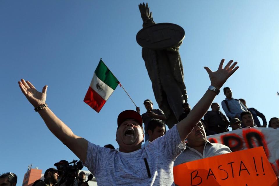 Demonstrators protest the presence of thousands of Central American migrants in Tijuana (AP)