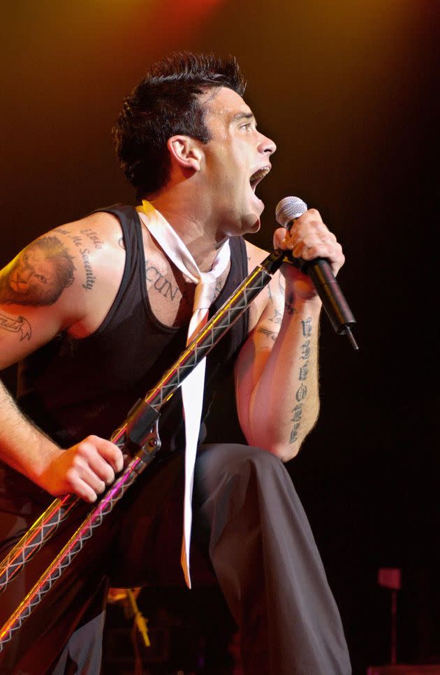 Robbie performing in 2003 to promote his hit album Escapology (Photo: BERTRAND GUAY via Getty Images)