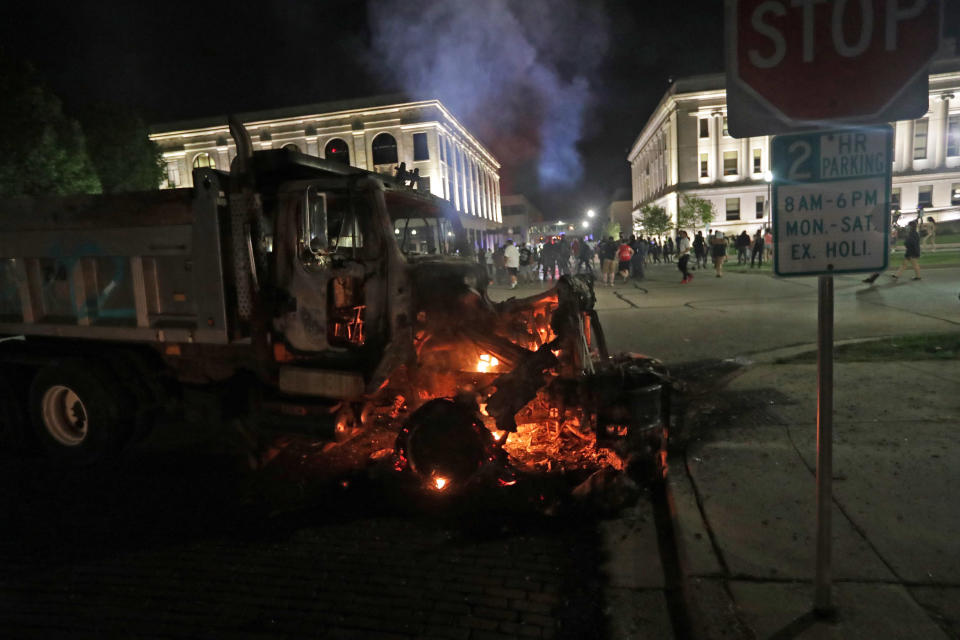 Aug 23, 2020; Kenosha, WI, USA; A city truck burns outside the Kenosha County courthouse in Kenosha on Sunday, Aug. 23, 2020. Kenosha police shot a man Sunday evening, setting off unrest in the city after a video appeared to show the officer firing several shots at close range into the man's back. Mandatory Credit: Mike De Sisti/Milwaukee Journal Sentinel via USA TODAY NETWORK/Sipa USA