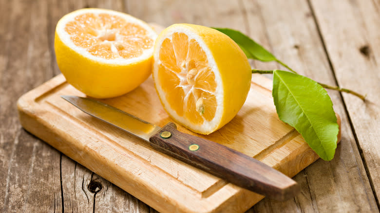 sliced lemon on cutting board