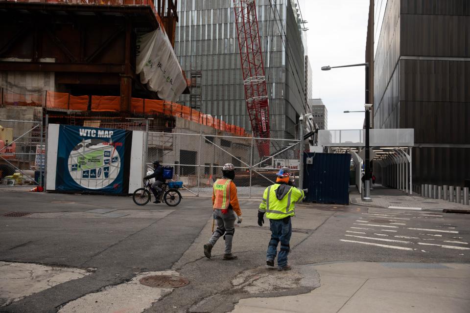 NEW YORK, Jan. 8, 2021 -- Construction workers walk in front of the Ronald O. Perelman Performing Arts Center at the World Trade Center construction site, in New York, United States, Jan. 8, 2021. U.S. employers slashed 140,000 jobs in December, the first monthly decline since April 2020, as the recent COVID-19 spikes disrupted labor market recovery, the Labor Department reported Friday.  The unemployment rate, which has been trending down over the past seven months, remained unchanged at 6.7 percent, according to the monthly employment report. (Photo by Michael Nagle/Xinhua via Getty) (Xinhua/Michael Nagle via Getty Images)