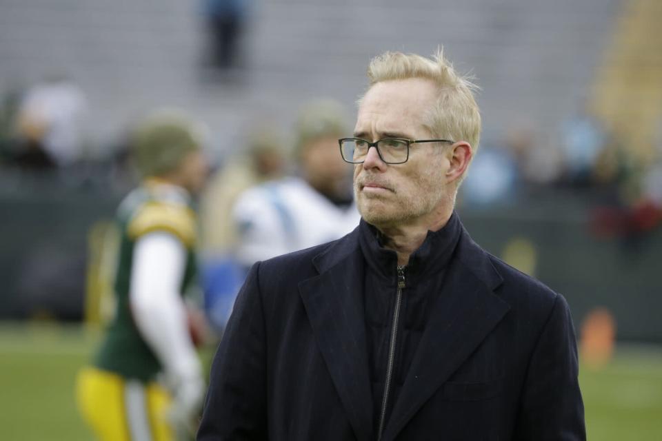 Joe Buck stands on a football field before a Green Bay Packers game.