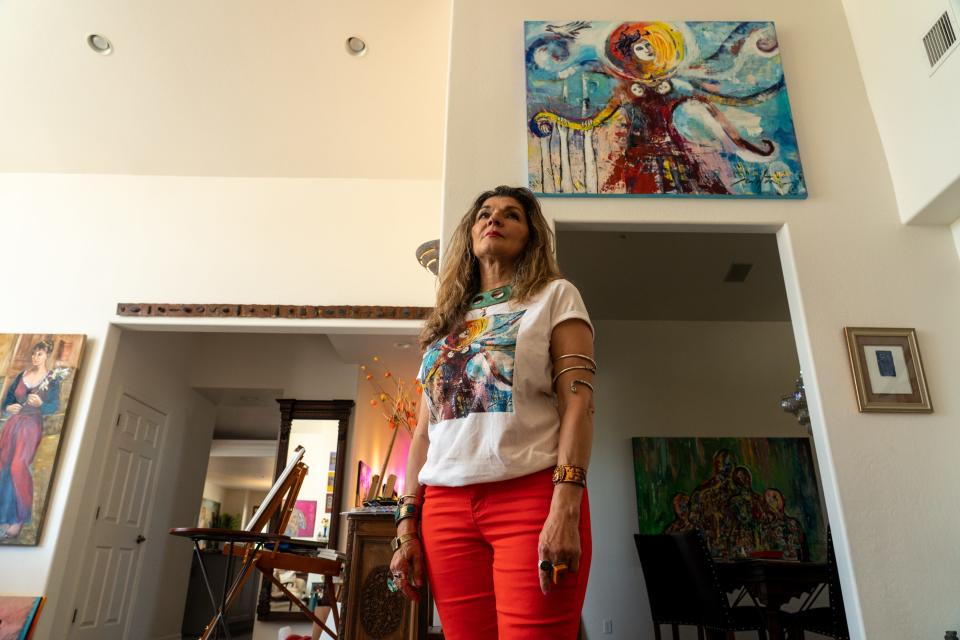 Artist Mitra Kamali poses for a portrait inside her home in Scottsdale on April 25, 2023.