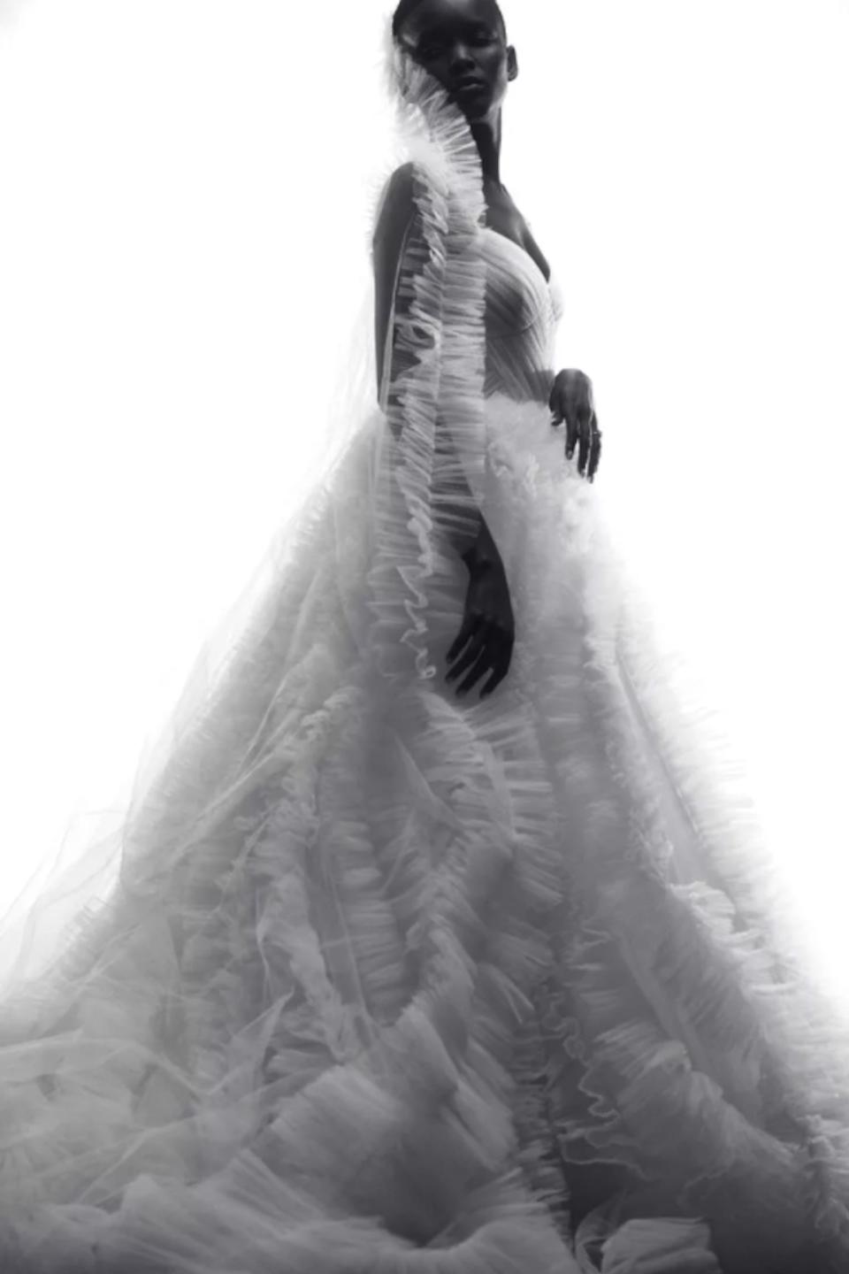 A bride looks over her shoulder.