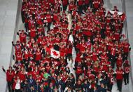 Athletes of Canada enter the stadium during the closing ceremony for the 2014 Sochi Winter Olympics, February 23, 2014. REUTERS/Eric Gaillard (RUSSIA - Tags: OLYMPICS SPORT)