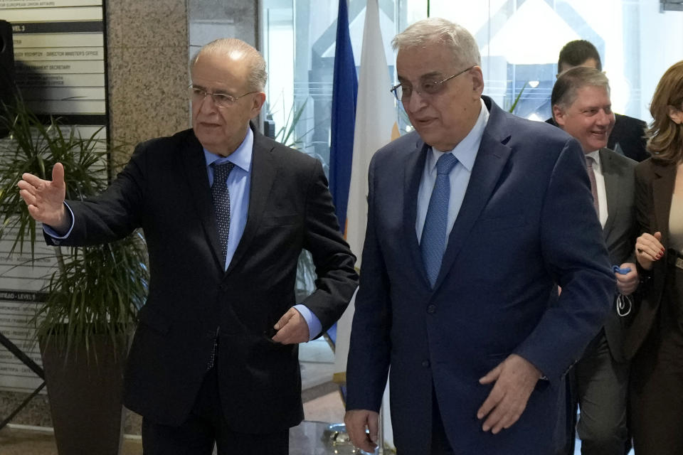 Cyprus' foreign minister Ioannis Kasoulides, left, welcomes his Lebanese counterpart Abdallah Bou Habib following their meeting at the foreign ministry house in Nicosia, Cyprus, Friday, April 15, 2022. Bou Habib is in Cyprus for one-day visit. (AP Photo/Petros Karadjias)
