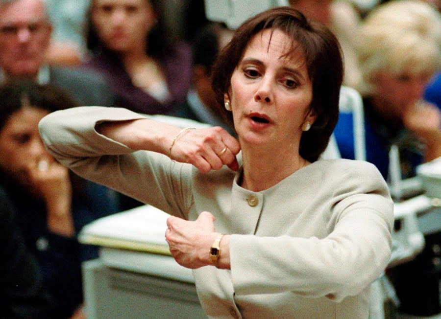 FILE – FILE – In this Sept. 26, 1995, file photo, prosecutor Marcia Clark demonstrates to the jury how the murders of Nicole Brown Simpson and Ron Goldman were committed during her closing arguments in O.J. Simpson’s double-murder trial in Los Angeles. Simpson, the decorated football superstar and Hollywood actor who was acquitted of charges he killed his former wife and her friend but later found liable in a separate civil trial, has died. He was 76. (Myung J. Chun/Los Angeles Daily News via AP, Pool, File)