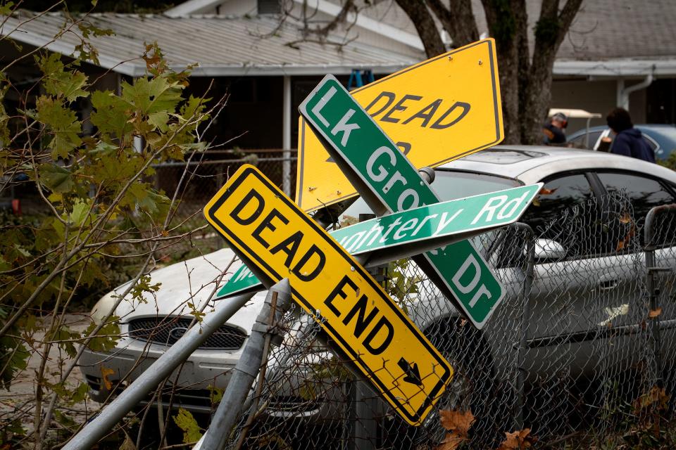 Street signs are twisted and damaged at the intersection of West Daughtery Rd and Lake Grove Drive after a tornado tore through the neighborhood last night in Lakeland Fl. Thursday December 17, 2020.