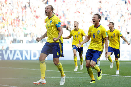 Soccer Football - World Cup - Group F - Sweden vs South Korea - Nizhny Novgorod Stadium, Nizhny Novgorod, Russia - June 18, 2018 Sweden's Andreas Granqvist celebrates with Albin Ekdal after scoring their first goal REUTERS/Matthew Childs