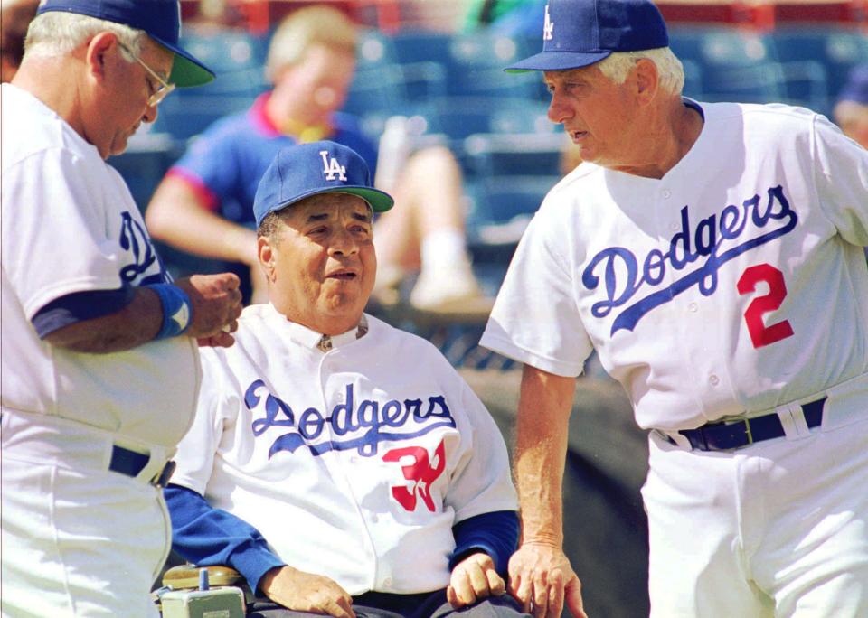 Ralph Avila, left, with Roy Campanella and Tommy Lasorda in 1993.