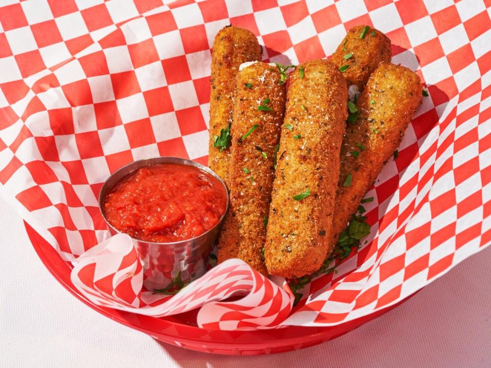 Fresh cut and fried "mozz sticks" are served at Parm.