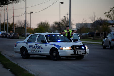 Schertz Police block off Doerr Lane near the scene of a blast at a FedEx facility in Schertz, Texas, U.S., March 20, 2018. REUTERS/Sergio Flores