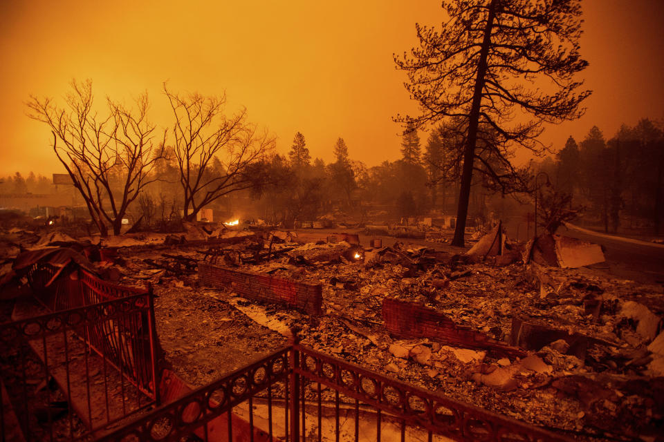 Rubble lines a lot on Skyway after a wildfire burned through Paradise, Calif., on Friday, Nov. 9, 2018. (AP Photo/Noah Berger)