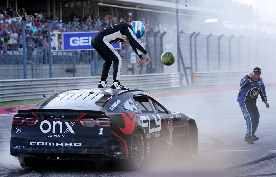 Mar 27, 2022; Austin, Texas, USA; NASCAR Cup Series driver Ross Chastain (1) smashes a watermelon on the ground after winning the EchoPark Automotive Texas Grand Prix at Circuit of the Americas. From a family of farmers, it's become the driver's signature celebration.