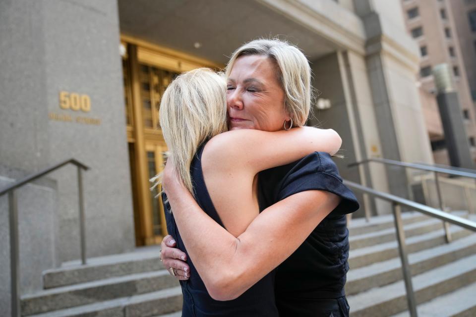 Sexual assault survivors Amy Yoney, right, and Laurie Kanyok, left, embrace after speaking to members of the media during a break in sentencing proceedings for convicted sex offender Robert Hadden outside Federal Court on Monday in New York. The former obstetrician was convicted of sexually abusing multiple patients over several decades.