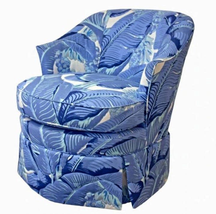 A chair is upholstered in a blue-and-white version of Braziliance, originally designed by the late decorator Dorothy Draper.