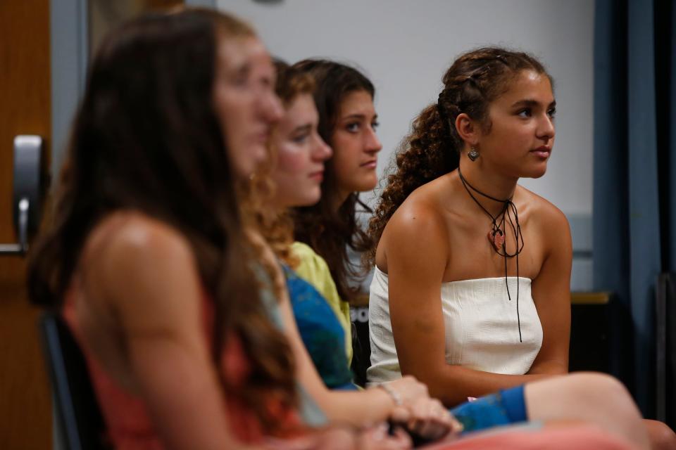 Tatum Reis, far right, looks on from her seat at the 2023 Mayor's List ceremony at Buttonwood Park Zoo in New Bedford on Wednesday, June 7.