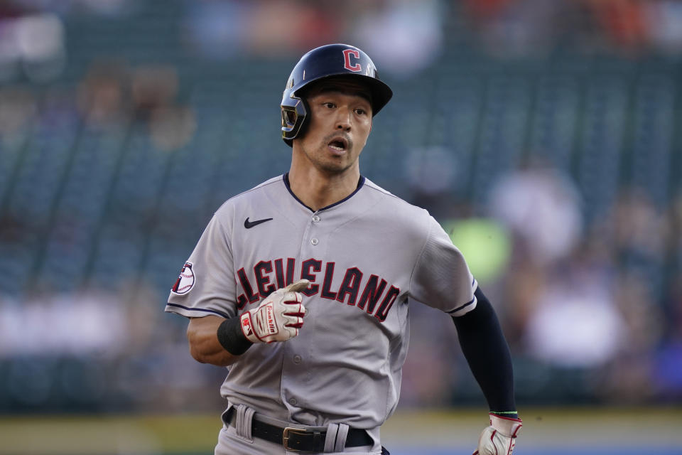 Cleveland Guardians' Steven Kwan heads to third for a triple during the first inning of a baseball game against the Detroit Tigers, Wednesday, Aug. 10, 2022, in Detroit. (AP Photo/Carlos Osorio)