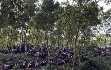 Rohingya refugees wait for aid to be distributed in Cox's Bazar, Bangladesh, September 21, 2017. REUTERS/Cathal McNaughton