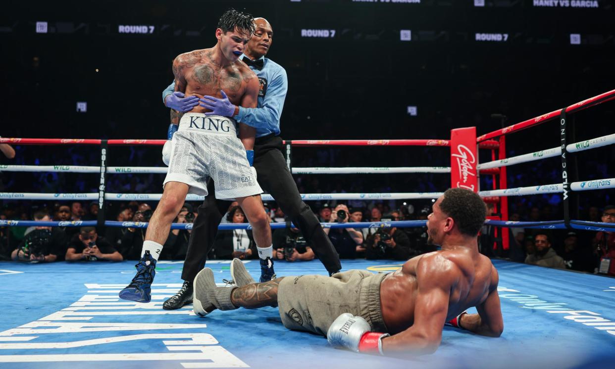 <span>Ryan Garcia knocks down Devin Haney during Saturday’s fight at Barclays Center.</span><span>Photograph: Cris Esqueda/Golden Boy</span>