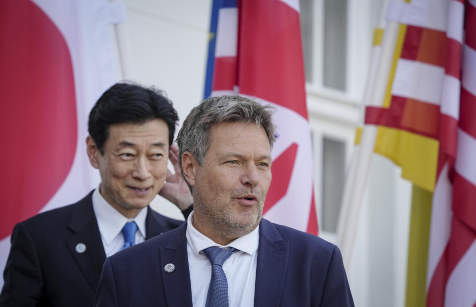 Robert Habeck, Federal Minister for Economic Affairs and Climate Protection, right, bids farewell to Yasutoshi Nishimura, Minister of Economy of Japan, after the meeting of the G7 trade ministers outside Neuhardenberg Castle. (Kay Nietfeld/dpa via AP)