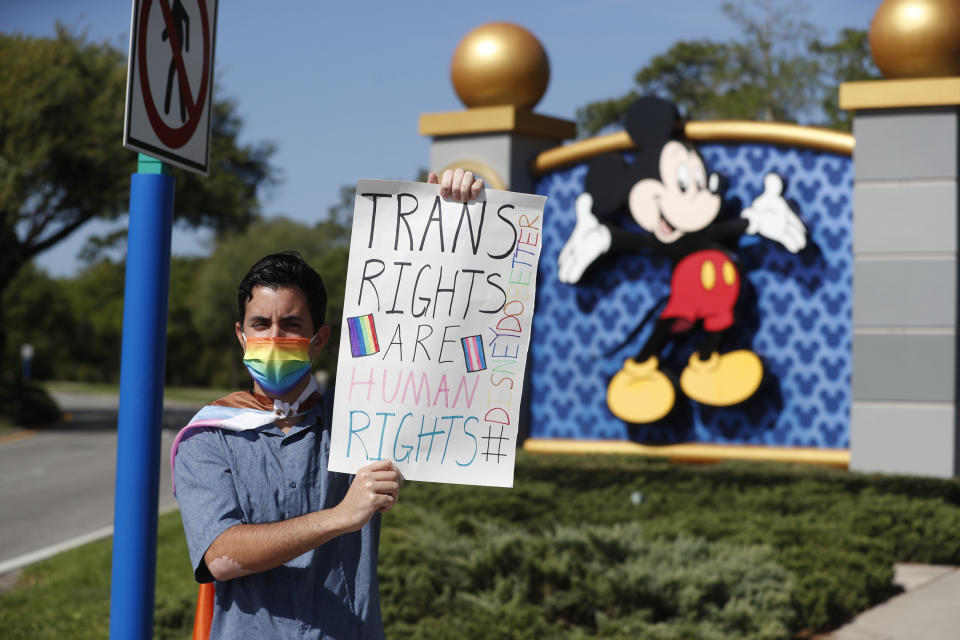 ORLANDO, FL - MARCH 22: Disney employee Nicholas Maldonado holds a sign while protesting outside of Walt Disney World on March 22, 2022 in Orlando, Florida. Employees are staging a company-wide walkout today to protest Walt Disney Co.'s response to controversial legislation passed in Florida known as the “Don’t Say Gay” bill. (Photo by Octavio Jones/Getty Images)