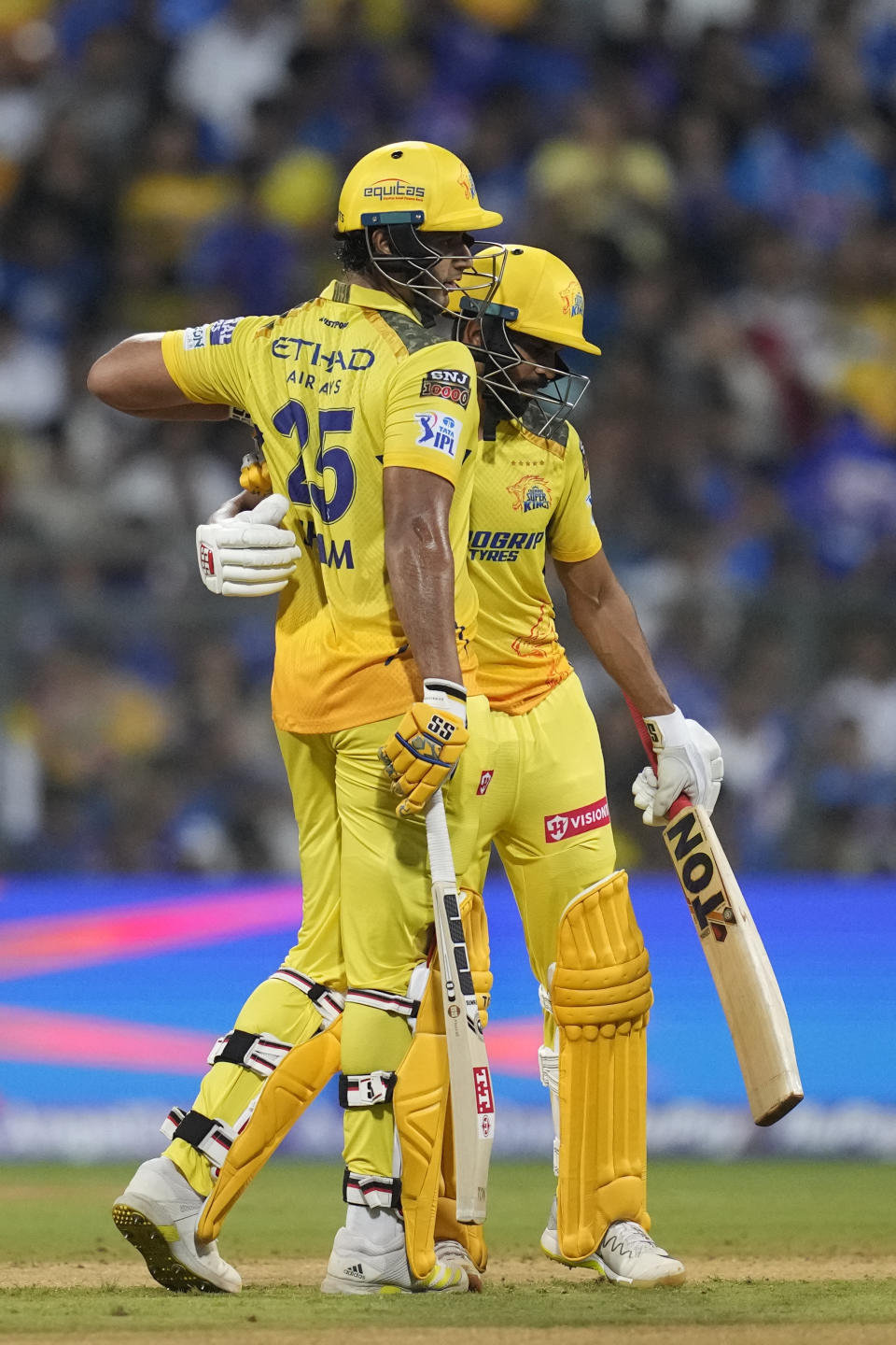 Chennai Super Kings' captain Ruturaj Gaikwad, right, greets Shivam Dube after scoring 50 runs during the Indian Premier League cricket match between Mumbai Indians' and Chennai Super Kings' in Mumbai, India, Sunday, April. 14, 2024.(AP Photo/ Rafiq Maqbool)