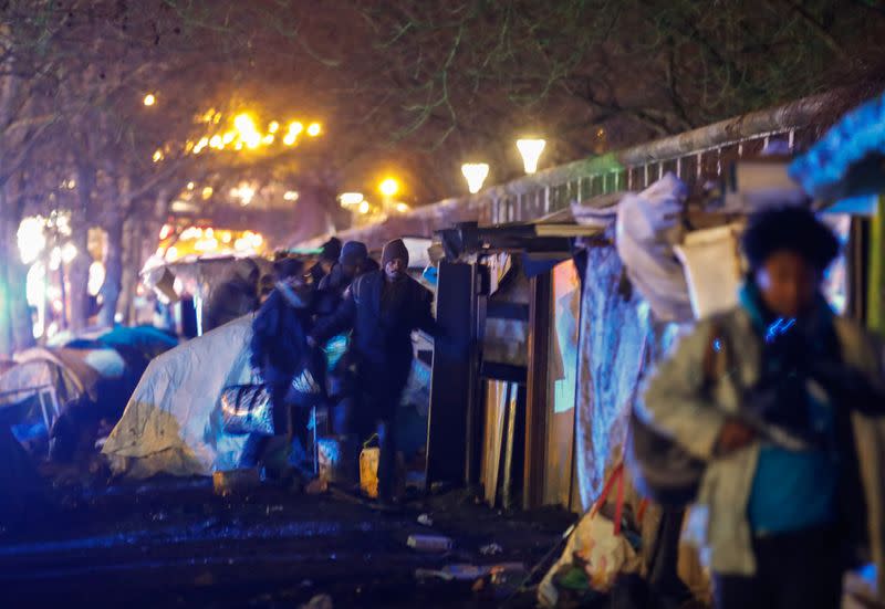 French police clear out migrants from an illegal camp in north Paris