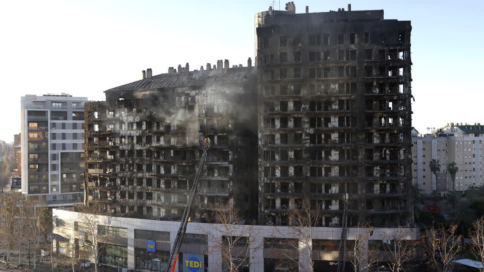 Firefighters inspect the aftermath of the fire in Valencia. - Jose Jordan/AFP/Getty Images