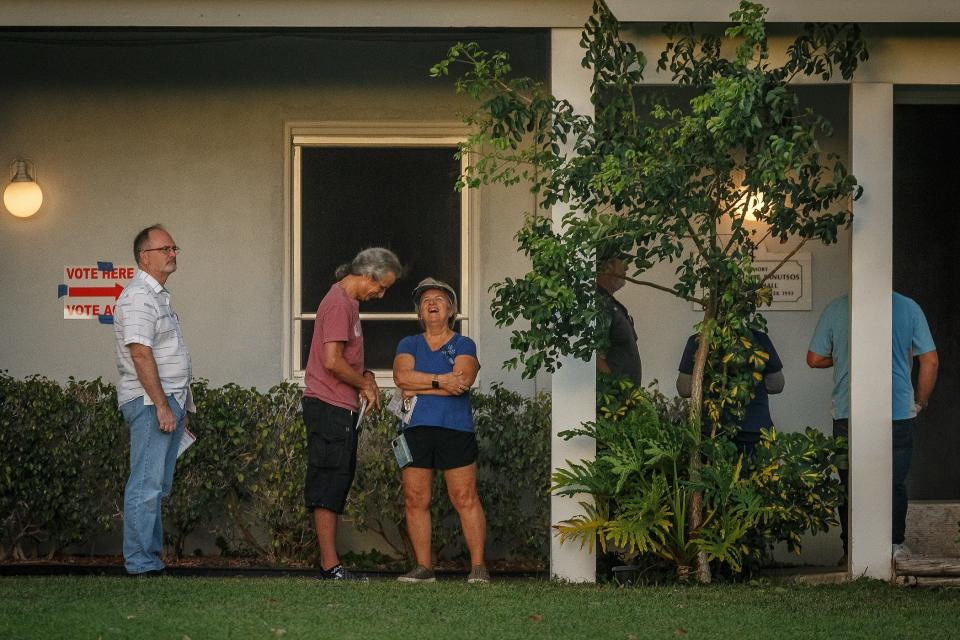 Citizens queue outside of St. Mary Orthodox Church at precinct 8645 as the polls ready to open at 7 a.m. on election day in Lake Clarke Shores, Fla., on November 8, 2022.