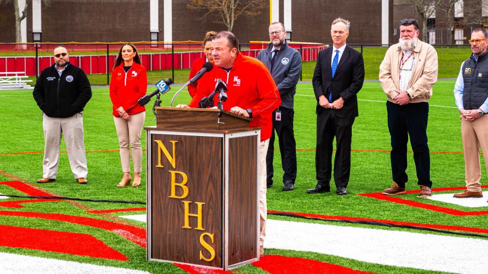 New Bedford High School Athletic Director, Tom Tarpey, speaks at the Ribbon Cutting Ceremony of the new turf field at New Bedford High School.