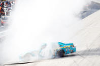 DOVER, DE - JUNE 03: Jimmie Johnson, driver of the #48 Lowe's Madagascar Chevrolet, performs a burnout to celebrate winning the NASCAR Sprint Cup Series FedEx 400 benefiting Autism Speaks at Dover International Speedway on June 3, 2012 in Dover, Delaware. (Photo by Todd Warshaw/Getty Images)