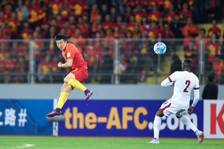 China v Qatar - World Cup 2018 Qualifier - Kunming, China - 15/11/16. Jiang Zhipeng of China and Mohamed Musa of Qatar in action. REUTERS/Stringer