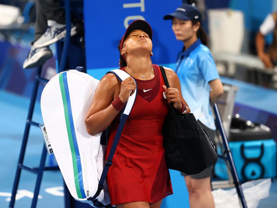Naomi Osaka reacts to her third-round Olympics loss.