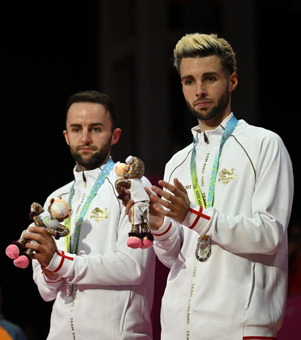 Silver medallists England's Ben Lane and England's Sean Vardy pose during the medal presentation ceremony men's doubles gold medal badminton match on day eleven of the Commonwealth Games at the NEC arena in Birmingham, central England, on August 8, 2022. (Photo by Ben Stansall / AFP) (Photo by BEN STANSALL/AFP via Getty Images)