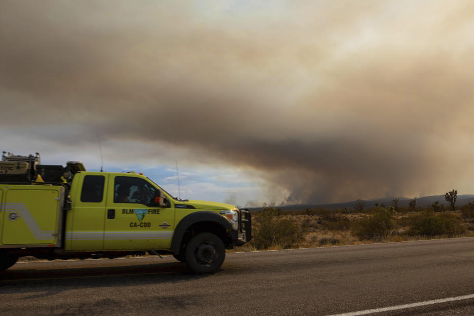 A fire truck heading towards the York Fire on Sunday, July 30, 2023, in the Mojave National Preserve, Calif. Crews battled “fire whirls” in California’s Mojave National Preserve this weekend as a massive wildfire crossed into Nevada amid dangerously high temperatures and raging winds. (AP Photo/Ty O'Neil)