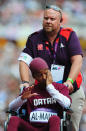 LONDON, ENGLAND - AUGUST 03: Noor Hussain Al-Malki of Qatar is wheeled away injured in the Women's 100m Heats on Day 7 of the London 2012 Olympic Games at Olympic Stadium on August 3, 2012 in London, England. (Photo by Stu Forster/Getty Images)